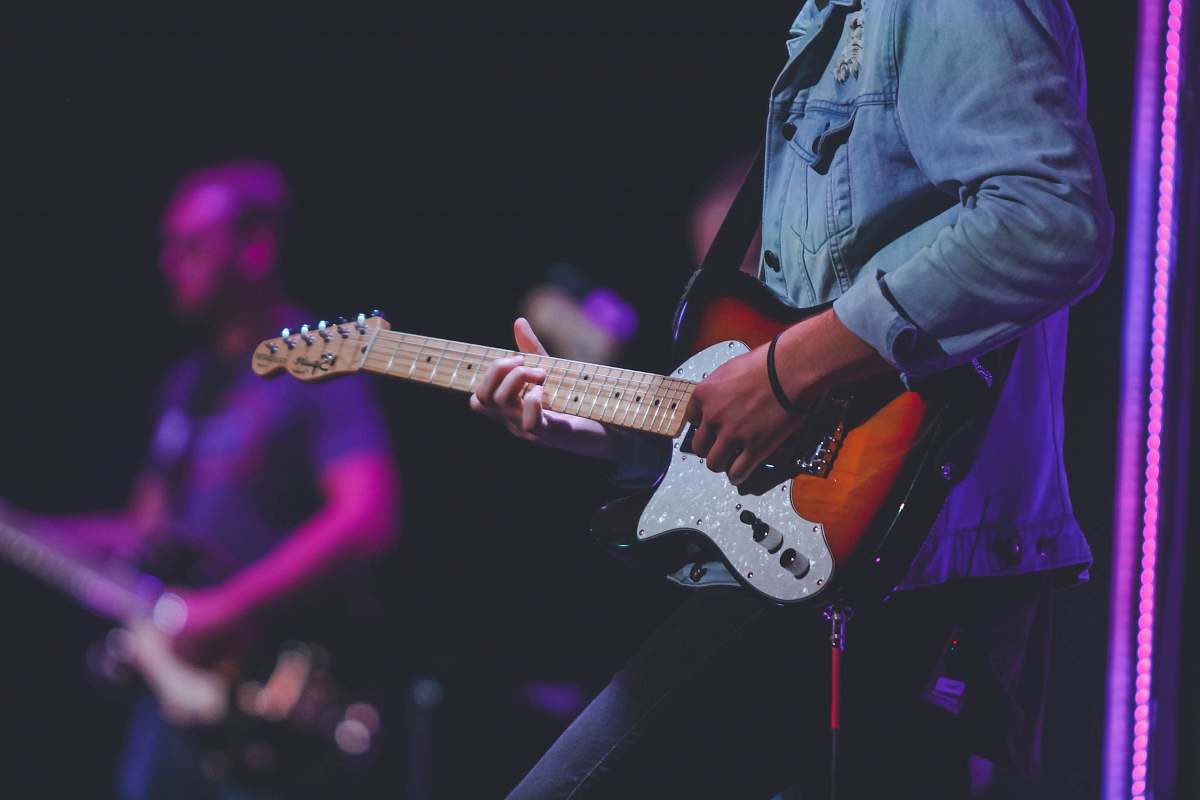 leisure activities man playing electric guitar musical instrument